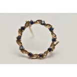 A 9CT GOLD SAPPHIRE AND DIAMOND BROOCH, circular brooch set with alternating circular cut blue