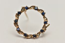 A 9CT GOLD SAPPHIRE AND DIAMOND BROOCH, circular brooch set with alternating circular cut blue