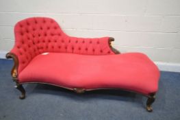 A VICTORIAN MAHOGANY CHAISE, with light red buttoned upholstery, on front cabriole legs, length