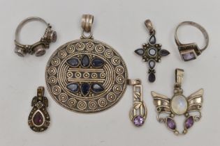 A SMALL BAG OF WHITE METAL JEWELLERY, to include five pendants set with stones to include