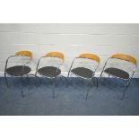A SET OF FOUR ITALIAN STACKABLE CHAIRS, with shaped wooden back, chrome tubular frame and black seat