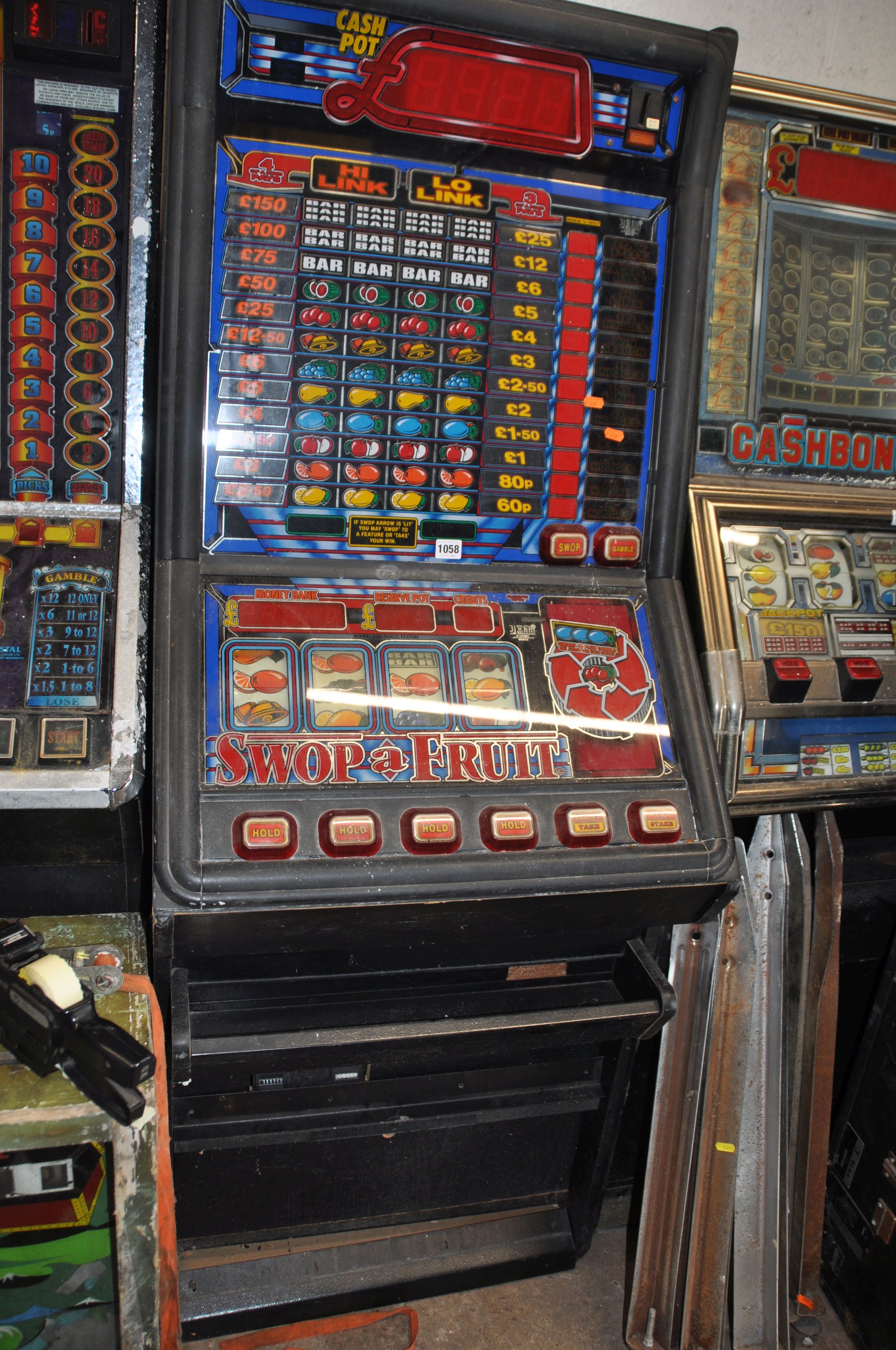 A JPM SLOT MACHINE with 'Swop a Fruit' graphics and mechanism (untested and maybe incomplete