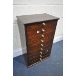 A SMALL STAINED PINE CHEST OF NINE DRAWERS, width 41cm x depth 31cm x height 71cm (condition report: