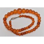 A GRADUATED FACETED COPAL AMBER BEAD NECKLACE, fitted with a white metal magnetic clasp, length