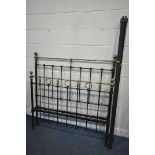 A VICTORIAN STYLE CAST IRON AND BRASS 4FT6 BEDSTEAD, with irons, along with a wicker headboard (