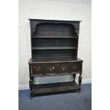 AN EARLY 20TH CENTURY OAK DRESSER, with two tier plate rack, over a base with two drawers, width