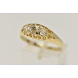 A YELLOW METAL THREE STONE DIAMOND RING, set with three old cut diamonds, estimated total diamond