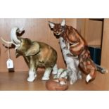 A ROYAL DUX ELEPHANT AND TWO FOX FIGURINES, comprising a 20th Century Royal Dux pottery figure of an