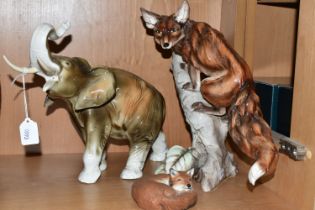 A ROYAL DUX ELEPHANT AND TWO FOX FIGURINES, comprising a 20th Century Royal Dux pottery figure of an