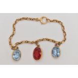 A YELLOW METAL GEM SET BRACELET, two oval cut synthetic blue spinel's and an oval cut synthetic