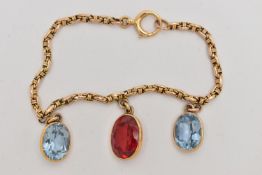 A YELLOW METAL GEM SET BRACELET, two oval cut synthetic blue spinel's and an oval cut synthetic