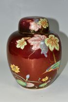 A CARLTON WARE GINGER JAR AND COVER WITH THE KINGFISHER PATTERN ON A ROUGE GROUND, the base