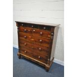 A VICTORIAN FLAME MAHOGANY CHEST OF NINE ASSORTED DRAWERS, on turned legs, width 125cm x depth