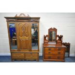 AN EDWARDIAN WALNUT DOUBLE DOOR MIRROR DOOR WARDROBE, over a base with two drawers, width 149cm x