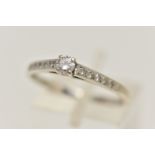 A 9CT WHITE GOLD DIAMOND RING, set with a central four claw set, round brilliant cut diamond,
