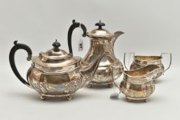 A GEORGE V SILVER FOUR PIECE TEA SERVICE OF FLUTED OVAL FORM, comprising tea pot, hot water jug,