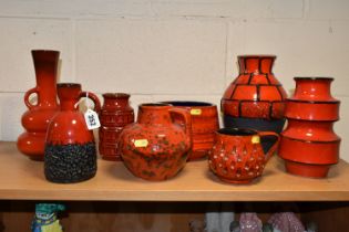 EIGHT WEST GERMAN RED GLAZED POTTERY VASES, EWERS, ETC, including a twin handled vase, height