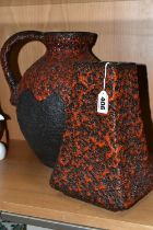 A GERMAN RED LAVA GLAZE DESIGN FLAGON, impressed Germany 990-30 on the base, together with a