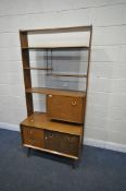 A MID CENTURY TEAK G PLAN EGOMME ROOM DIVIDER, with four shelves, two fall front cupboard doors