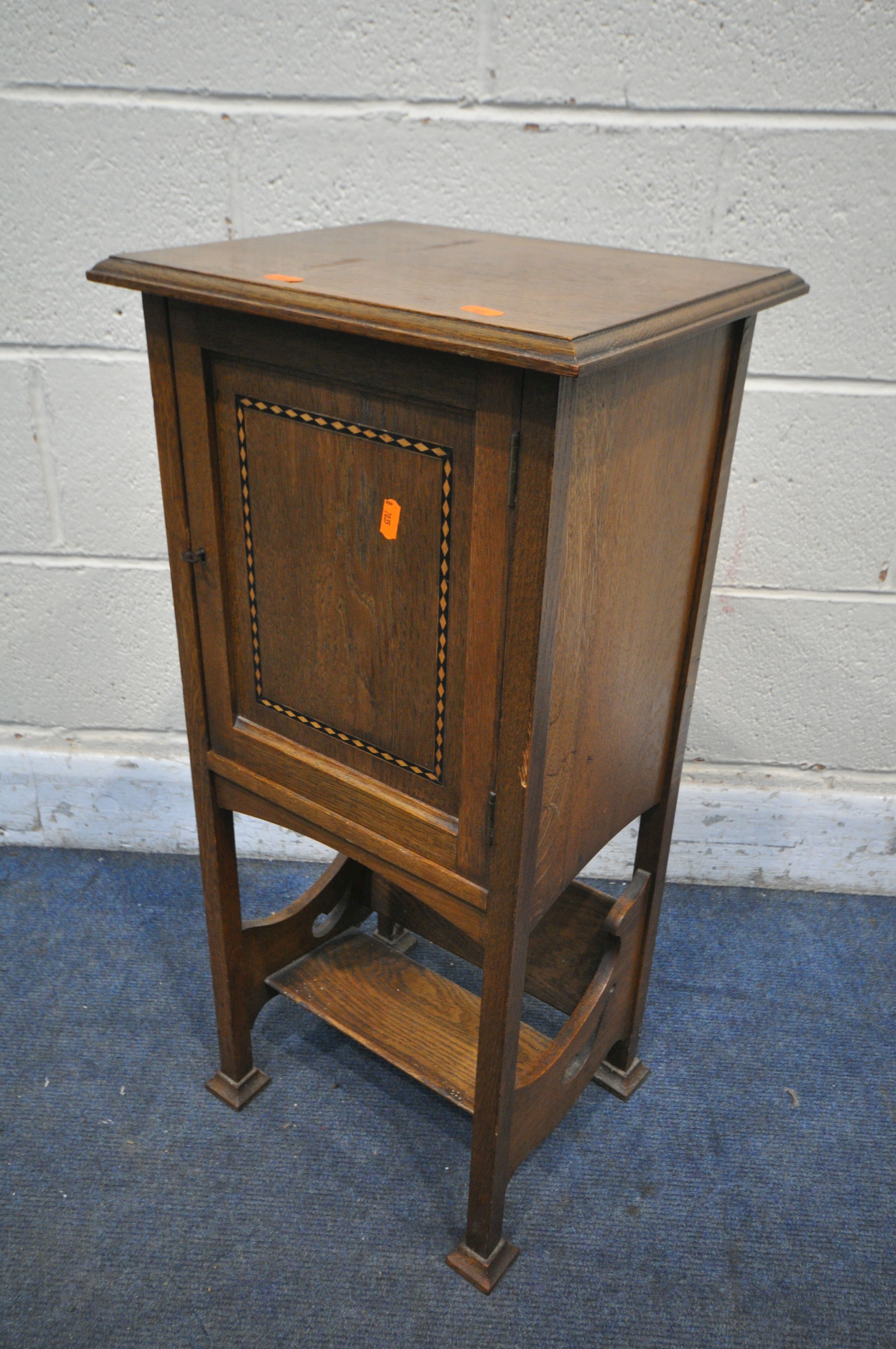 AN ARTS AND CRAFTS OAK SINGLE DOOR SMOKERS CABINET, width 36cm x depth 31cm x height 78cm (condition