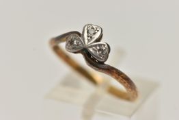 A TREFOIL DIAMOND RING, three single cut diamonds, set in a clover design mount leading on to a