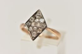 A YELLOW METAL DIAMOND RING, rhombus shape set with eleven old cut diamonds and one round