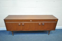 A MID CENTURY TEAK SIDEBOARD, with three drawers, above two cupboard doors, flanking a fall front