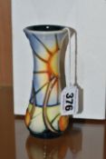 A BOXED MOORCROFT BUD VASE DECORATED WITH A SUN AND FRUIT DESIGN (AUSTRALIAN SUNBURST?), impressed