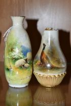 TWO DAMAGED ROYAL WORCESTER PORCELAIN VASES, comprising a baluster vase painted with a pheasant