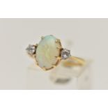 A YELLOW METAL OPAL AND DIAMOND RING, centring on an oval cut opal cabochon, in a nine claw setting,