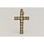 A YELLOW METAL OPAL CROSS PENDANT, set with twelve circular cut opal cabochons, to a polished mount,