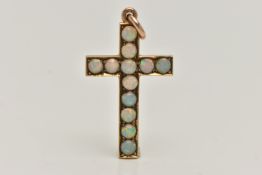 A YELLOW METAL OPAL CROSS PENDANT, set with twelve circular cut opal cabochons, to a polished mount,