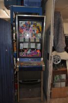 AN ACE COIN EQUIPMENT VINTAGE SLOT MACHINE with 'Warlord' graphics and mechanism, width 53cm x depth