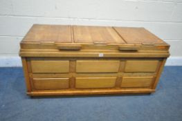 AN OAK STORAGE CHEST, with a hinged lid, with three other smaller hinged compartments inside, length