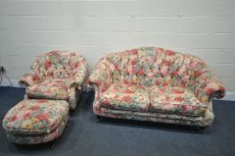 A FOLORAL UPHOLSTERED THREE PIECE BUTTON BACK SUITE, comprising a two seater sofa, length 164cm x