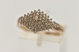 A DIAMOND CLUSTER RING, forty nine single cut diamonds, prong set in white metal, leading on to a