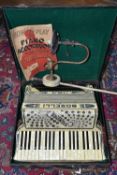 A SIGNORA BOSELLI ITALIA Piano Accordion in a case with a 'How To Play the Piano Accordeon' book
