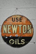 A VINTAGE CIRCULAR ENAMELLED SIGN, reading use Newton oils, diameter 43cm (condition report: well