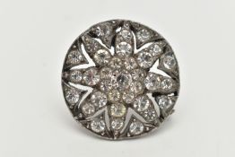 AN EARLY 20TH CENTURY, WHITE METAL PASTE SET BROOCH, of a circular open work outline, set with