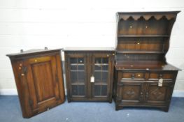 A 20TH CENTURY OAK DRESSER, the top with a two tier plate rack, the base with two drawers and two
