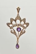 AN EARLY 20TH CENTURY LAVALIER PENDANT/BROOCH, an open work pendant set with a principle circular