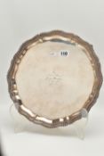 AN ELIZABETH II SILVER SALVER, circular salver with wavy gadrooned rim, on four scroll feet,