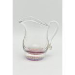 A VICTORIAN STYLE CLEAR GLASS PAPERWEIGHT CREAM JUG OF BALUSTER FORM, with millefiori cane base,