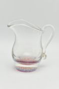 A VICTORIAN STYLE CLEAR GLASS PAPERWEIGHT CREAM JUG OF BALUSTER FORM, with millefiori cane base,