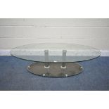 AN OVAL GLASS COFFEE TABLE, length 136cm x depth 65cm (condition report: in need of a clean)