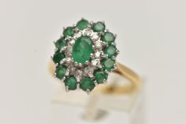 AN 18CT GOLD EMERALD AND DIAMOND CLUSTER RING, oval cluster set with a central oval cut emerald,