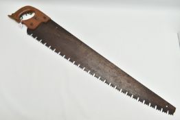 A VINTAGE ONE MAN CROSSCUT SAW, circular rusted 'Warranted Superior' badge to the wooden handle,