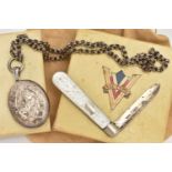 A LATE VICTORIAN SILVER LOCKET AND CHAIN WITH A SILVER FRUIT KNIFE, oval ivy leaf detailed locket,