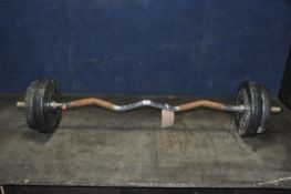 A METAL CURLING BAR, with two 5kg and two 2.5kg weights (condition report: rusty bar, in need of