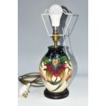 A MOORCROFT POTTERY 'ANNA LILY' TABLE LAMP, the baluster lamp tube-lined with deep red and orange